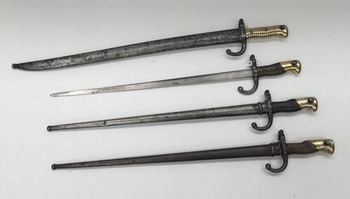 A selection of 19th century French bayonets.
 4 examples, including 3 Le Gras pieces, and 1 Chassepot example.
 The Le Gras bayonets are of standard forms, with wooden slab grips, and polished brass pommels.
 Steel cross guards and quillons, and straight 