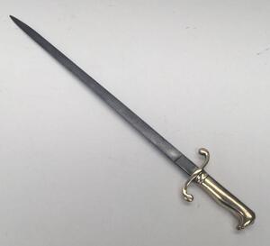 A 19th century Prussian M1864 NCO’s short sword or side arm.
 Brass handle with diagonally grooved grip to one side, and a beak shaped pommel.
 Curled quillons to the cross guard.
 Straight steel single edged blade, un-fullered with a flat spine.
 No appa - 3