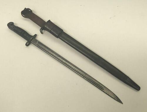 A British 1907 pattern bayonet, with scabbard and frog.
 Faintly date marked 3. 18 at the ricasso.
 GR and crown marked, along with various inspection stamps and bend test marks.
 The bayonet appears to have the later P1914/17 grooved grips fitted, but is