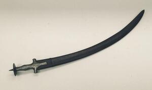 A late 19th century Indian Tulwar sword.
 Of traditional form, and of all steel construction.
 Disc shaped pommel with spike finial.
 Cross guard with convex quillons, plus long langets to each side of the blade.
 Curved single edge blade, un-fullered, an - 6