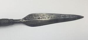 A 19th century South African throwing spear, possibly a Zulu Iklwa.
 Polished wooden shaft with flared and shaped end.
 Hand forged diamond section blade, with raised median ridge to both sides.
 The blade is secured to the shaft with what appears to be a - 4