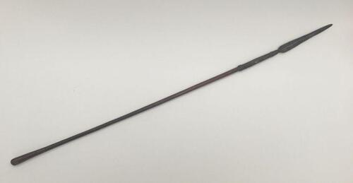 A 19th century South African throwing spear, possibly a Zulu Iklwa.
 Polished wooden shaft with flared end, and simple ring decoration.
 Hand forged metal blade of flattened diamond form, with raised median ridge to each side.
 The blade is attached to th