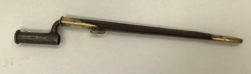 British ‘Brown Bess’ Socket Bayonet with scabbard, not marked, blade length 38cm. Some pitting to surface.