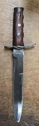 WW1 period Trench/Fighting Knife, off set double edged 8” blade, missing scabbed, wooden grip. Overall length 12.5”