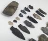 A collection of 24 ancient Native American flint arrow heads, spear heads, and an axe head.
 Various sizes and shapes.
 Notes: all of the examples were excavated in Dakota, USA, by a relative of the vendor.
 The axe head measures approximately 9.5cm x 4.8 - 3