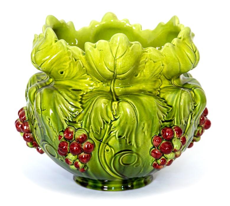 A Bretby Art Pottery jardiniere with heavily moulded grape vine and