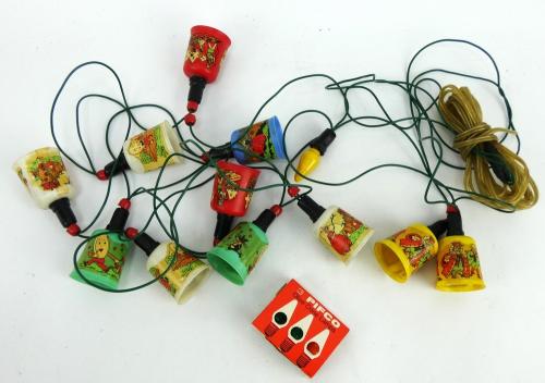 A string of vintage 1960s Christmas lights, the plastic shades each depicting fairy tales. Untested