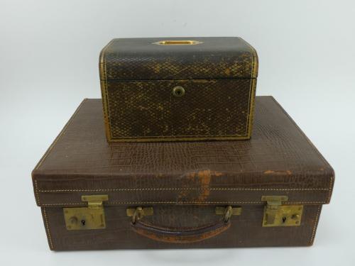 A Victorian leather bound fully fitted jewellery box with 2 trays and an early 20th century fitted travel case in mock croc leather. Jewellery box 25cm x 19cm x 15cm. Case 46cm x 35cm x 15cm.