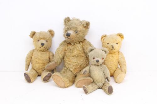 Bears: A collection of four vintage mid-20th century bears, unmarked, one with musical addition but in need of attention. Loved condition. Differing measurements. Please assess photographs. (4)