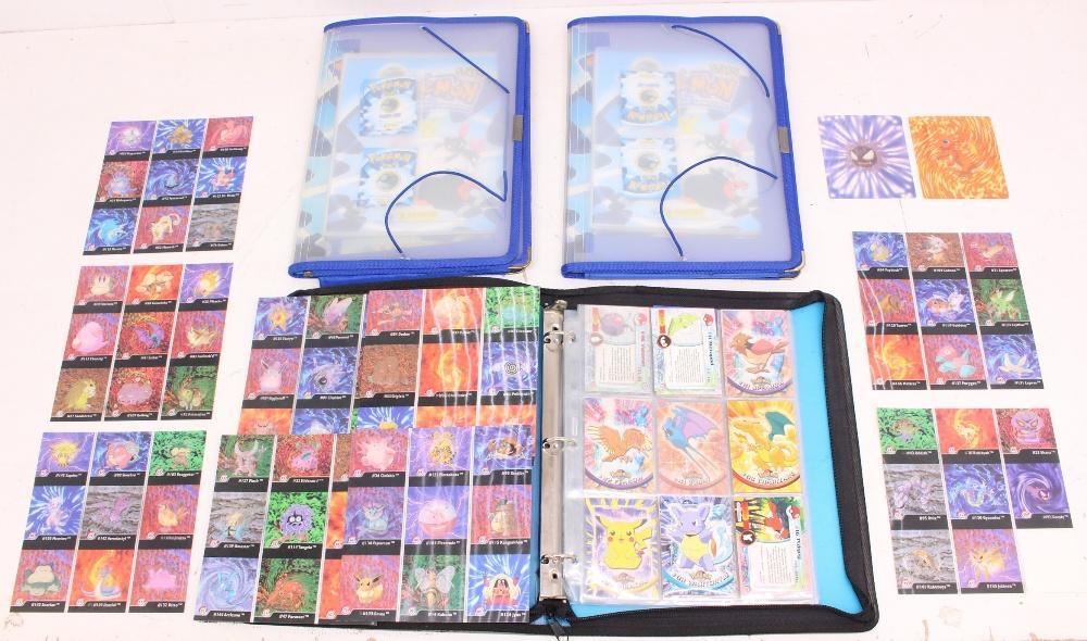 Pokemon: A collection of assorted Pokemon Topps cards; together with two folders with empty Staks binders; Pokemon: A collection of assorted Pokemon Topps cards; together with two folders with empty Staks binders;
