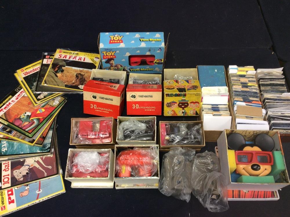 A collection of assorted View-master viewers, some with original
