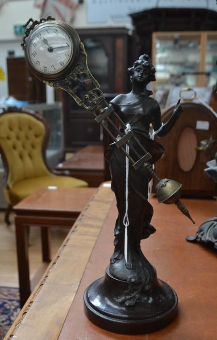 A German Art Nouveau Junghans Mystery clock with spelter bronze