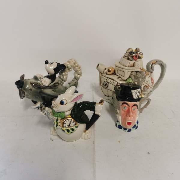 A collection of collectable teapots relating to Winnie The Pooh to