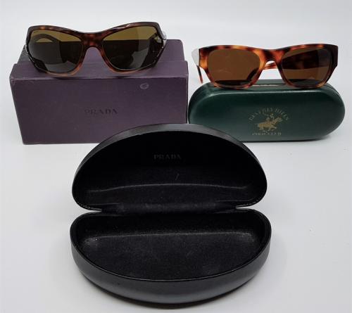 A pair of Prada sunglasses, in case with box, together with a pair of  Vintage Beverly Hills Polo Club sunglasses. (2)