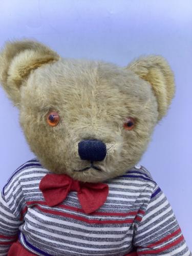 Vintage Large Chad valley ( no Label) 27” golden 1950s articulated teddy bear-dressed in a red shorts set. Amber glass eyes and faux suede rexine cloth pads. Vintage playworn and fully articulated. (1)