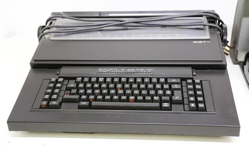 A cased Contex Method of Operation calculator machine in black ...