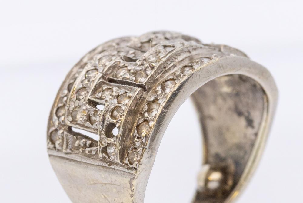 A diamond and 9ct white gold cluster ring, interlocking key design ...