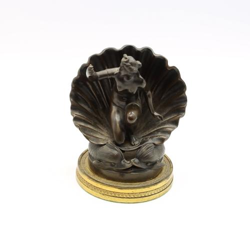 An early 19th Century French bronze cast as Venus emerging from a clam shell with dolphin supporters, on gilt metal base, 15cm high 

 Provenance: Hammersley Galleries Harpenden, 3rd March 1970

 ? from the Hall, Brachefield