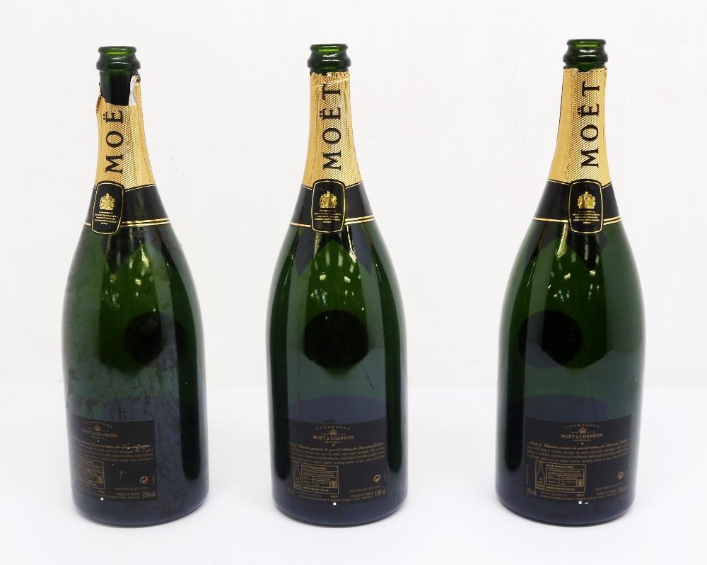 Three empty bottles of Moet and Chandon used for the Queen's
