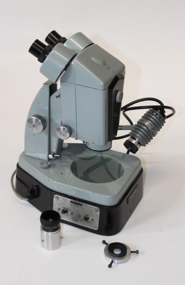 A Watson enamel finished binocular optical microscope