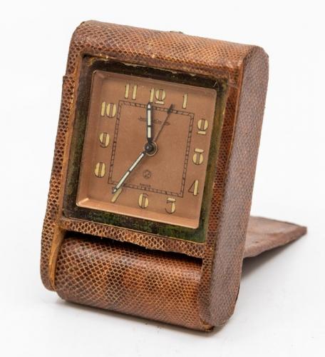 A Jaeger LeCoultre snakeskin cased travel alarm clock with eight