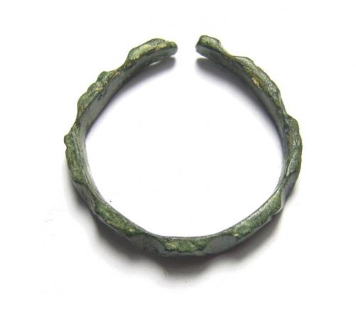 Medieval Fishing Weight. Circa 13th - 15th century AD. 88.05 grams. 75.81  mm. An elliptical-shaped lead fishing weight with tapering ends. On each  side is a raised rib that forms the circular