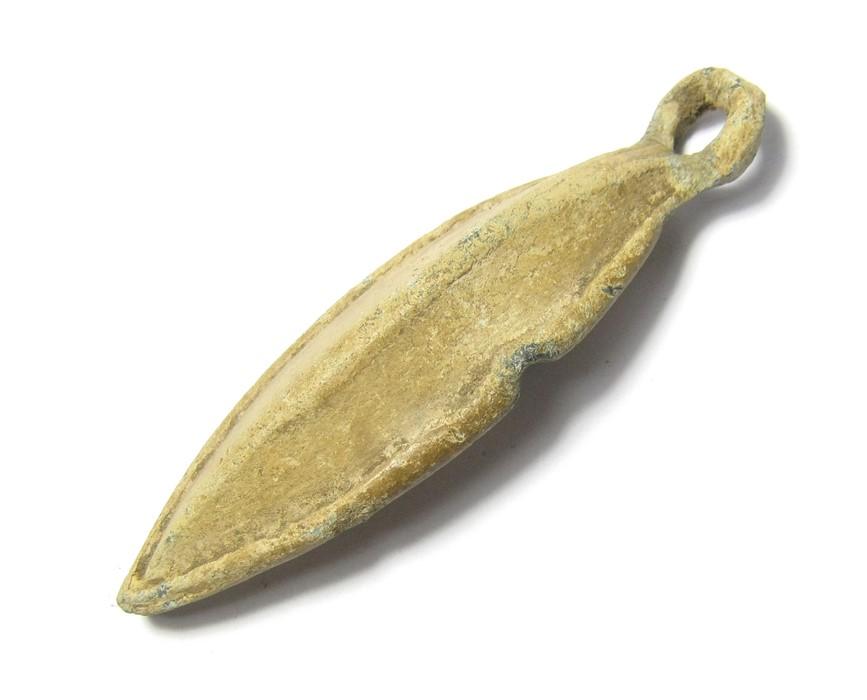 Medieval Fishing Weight. Circa 13th - 15th century AD. 88.05 grams. 75.81  mm. An elliptical-shaped lead fishing weight with tapering ends. On each  side is a raised rib that forms the circular