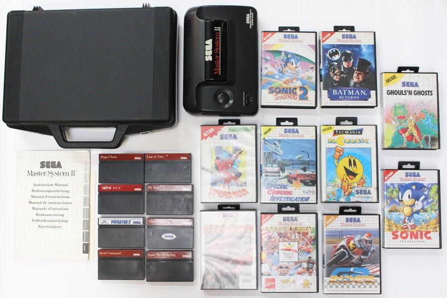 Sega: A Sega Master System II console with adaptor, lead and instructions,  contained within hard carry case; together with various cased games to  include: Pit-Fighter, Olympic Gold, Spider-Man, Special Criminal  Investigation, Sonic