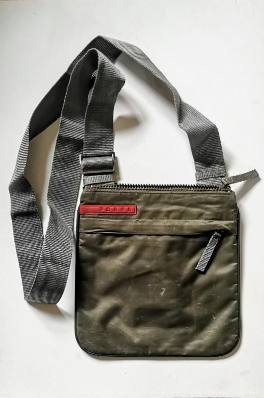 Prada Cross Body bag in dark green and grey.Zip compartments to