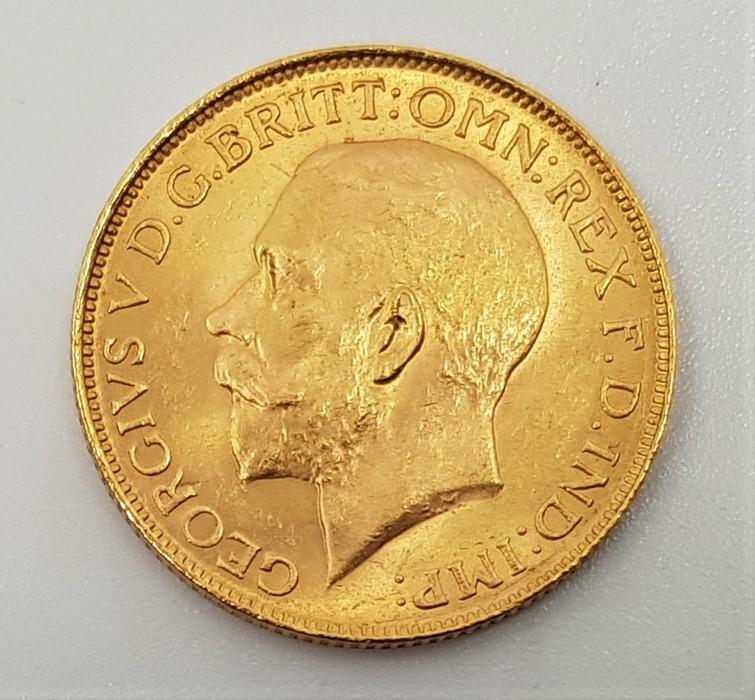 A 1925 George V gold sovereign, Pretoria mint.